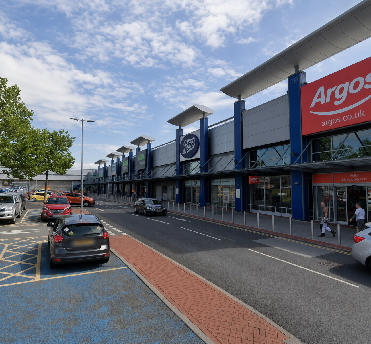 Retail park frontage with unit signage and parking bays